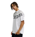 A young person with medium-length braids wears the Men’s DC Omega 2 Tee by DC Shoes—a loose, white skate t-shirt crafted from soft cotton and featuring layered, distorted black and gray text across the chest and shoulders—standing against a plain white background.