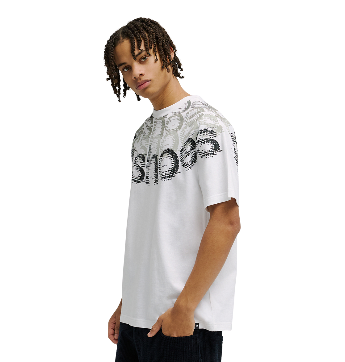 A young person with medium-length braids wears the Men’s DC Omega 2 Tee by DC Shoes—a loose, white skate t-shirt crafted from soft cotton and featuring layered, distorted black and gray text across the chest and shoulders—standing against a plain white background.