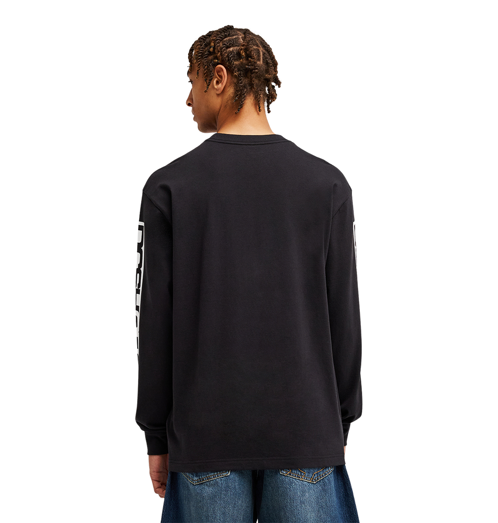 A person with short, braided hair is seen from behind against a plain light background, wearing the Men's DC Echo Tee by DC Shoes—a black graphic T-shirt with bold white sleeve text—paired with blue jeans, perfectly styled for laid-back skate sessions or casual hangouts.